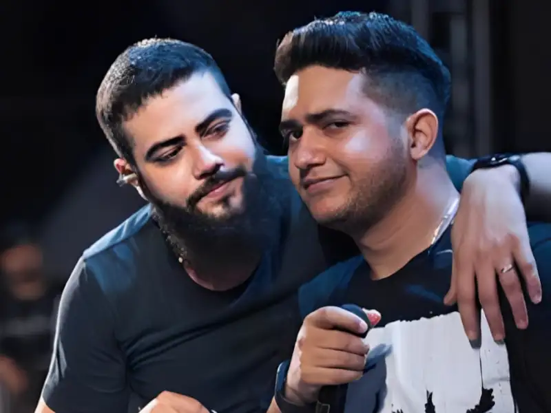 Poster de Henrique e Juliano com frases marcantes e mensagens inspiradoras